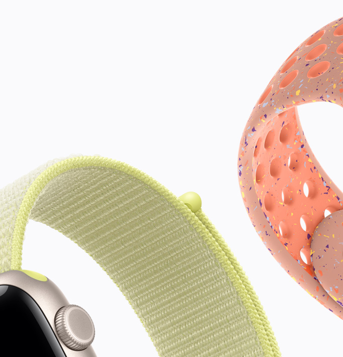 Apple Watch SE 3，展示星光色鋁金屬錶殼、霓虹黃色運動型錶環、峰霞粉色 Nike 運動型錶帶