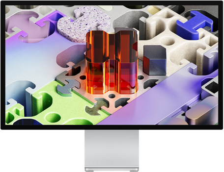 Vue avant d’un Studio Display XDR avec un fond d’écran tridimensionnel évoquant un puzzle