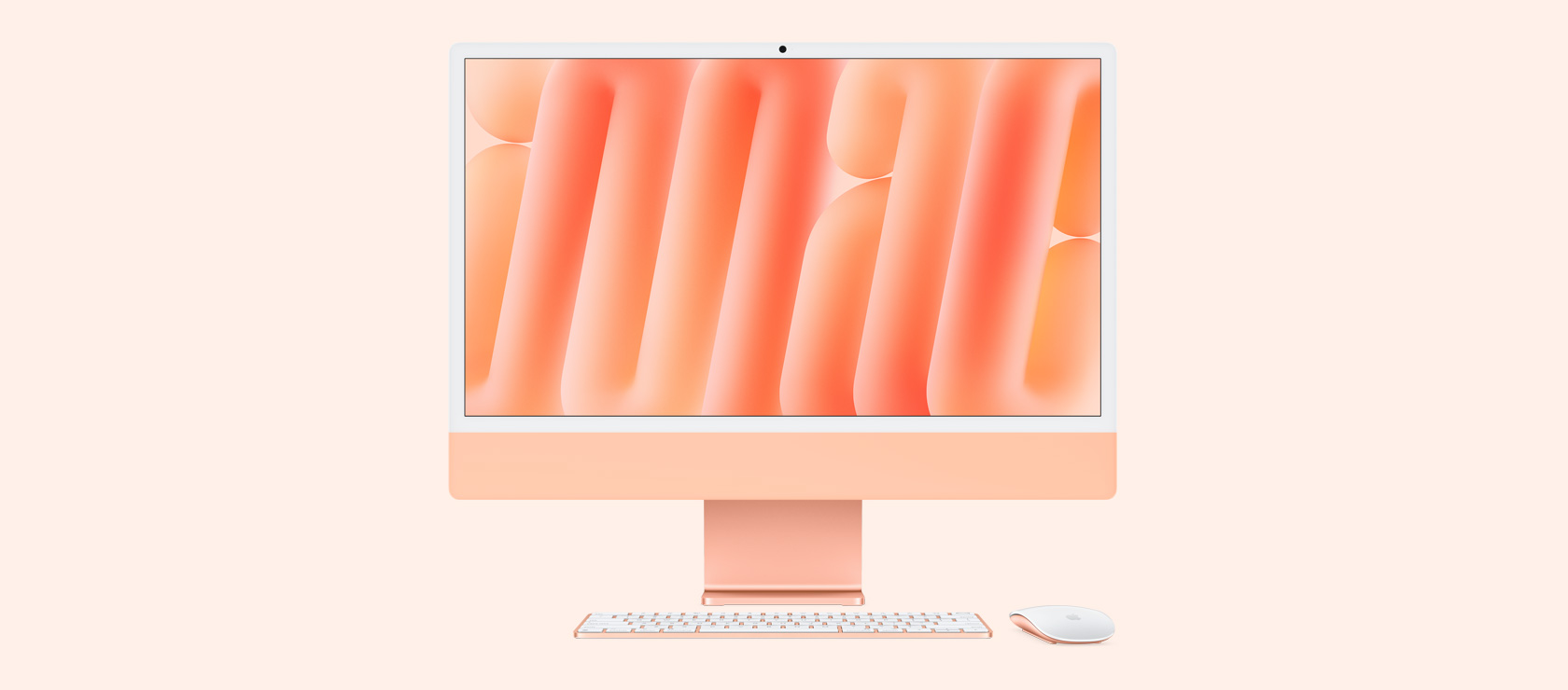 Imagem da frente de um iMac laranja com mouse e keyboard na mesma cor