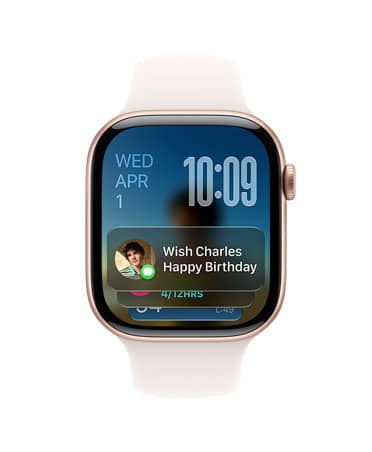 Apple Watch Series 11, Rose Gold with light blush band, face shows date at top left, time on top right and Messages widget at bottom